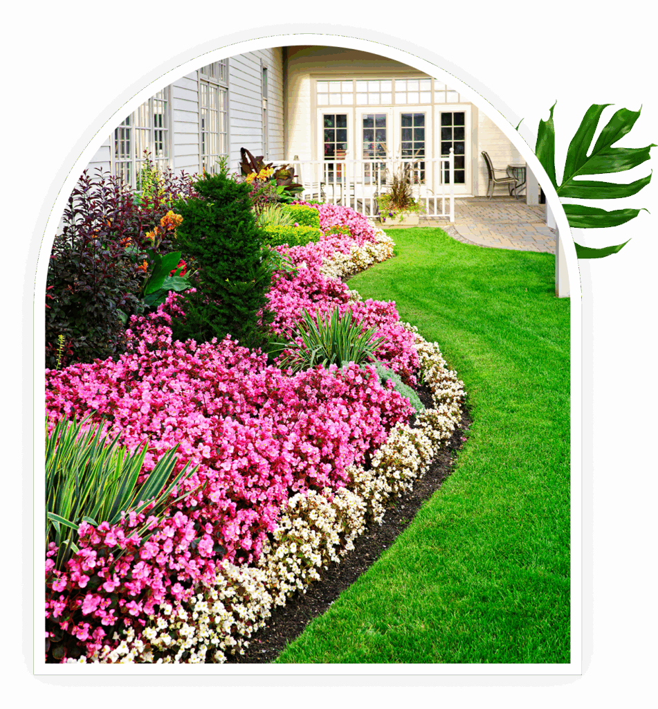 Colorful garden with flowers and green lawn.